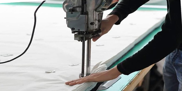 cutting materials for custom sportswear production